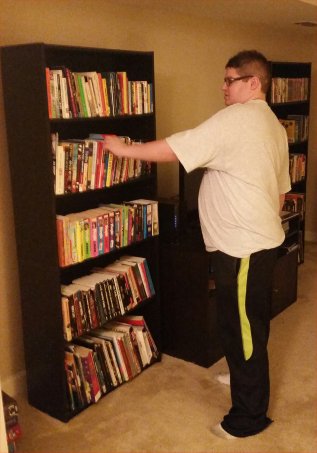 Corey with bookcases
